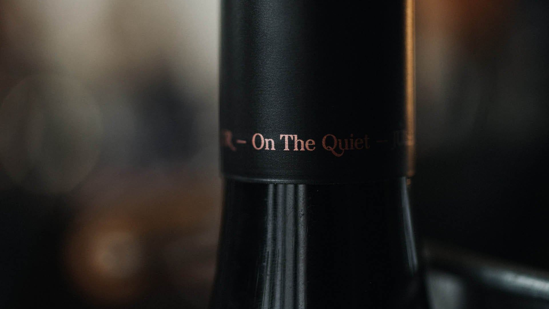 A close-up of an On The Quiet cap